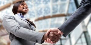 image of manager shaking hands with employee